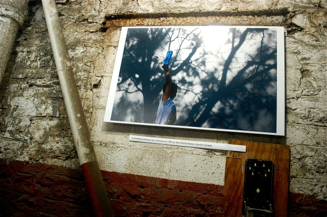 Just one impressive photo in the unusual, creative exhibit scene at Vasquez Muffler on Jerome Ave. This photo in exhibit is by Osaretin Ugiagbe. This blog photo by Jordan Moss.  